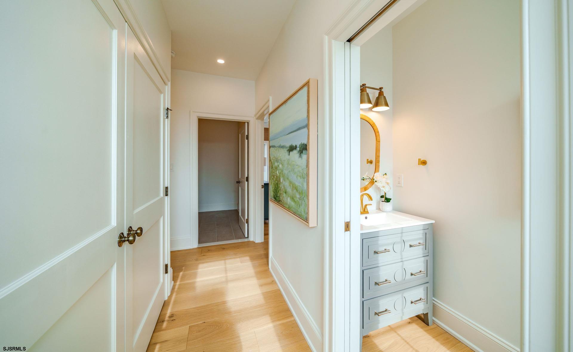 5217 Simpson Avenue Ocean City, NJ 08226 - Photo 18 of 52 a view of a hallway with bathroom and wooden floor