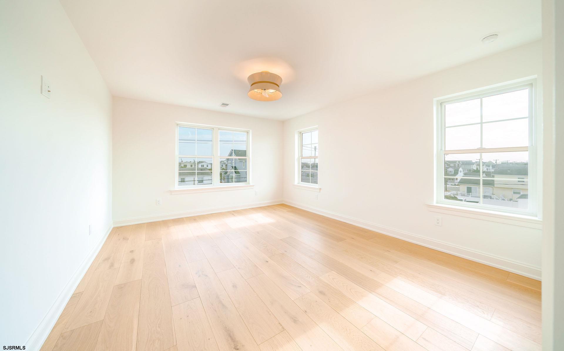 5217 Simpson Avenue Ocean City, NJ 08226 - Photo 25 of 52 an empty room with windows