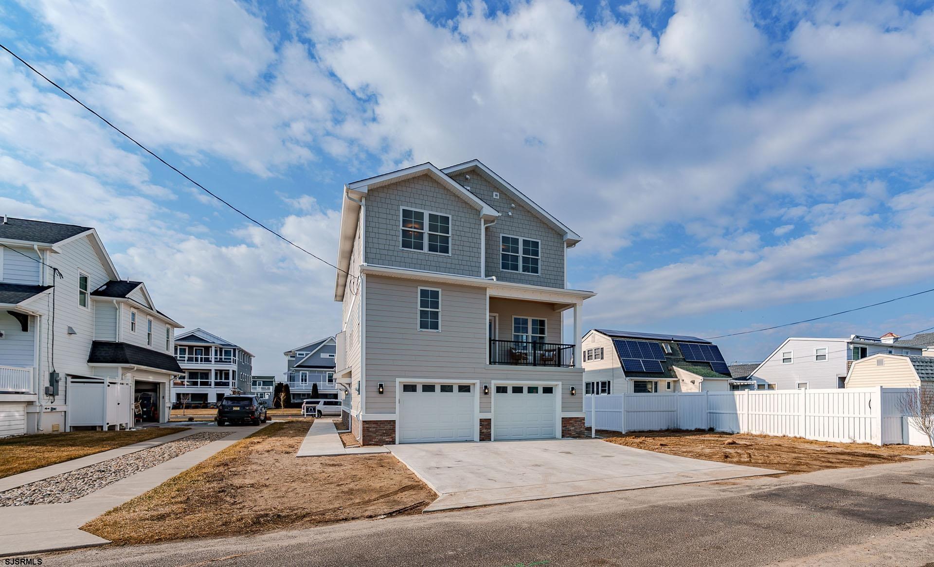 5217 Simpson Avenue Ocean City, NJ 08226 - Photo 42 of 52 a front view of a house with a yard