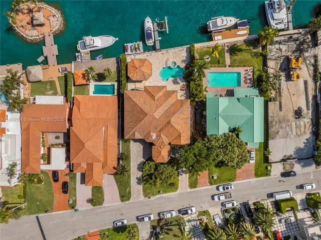 an aerial view of a house with outdoor space pool seating area and outdoor seating