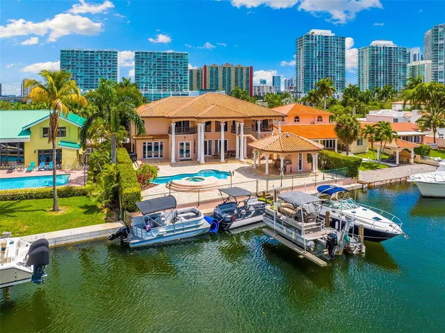 an aerial view of a houses with a lake view