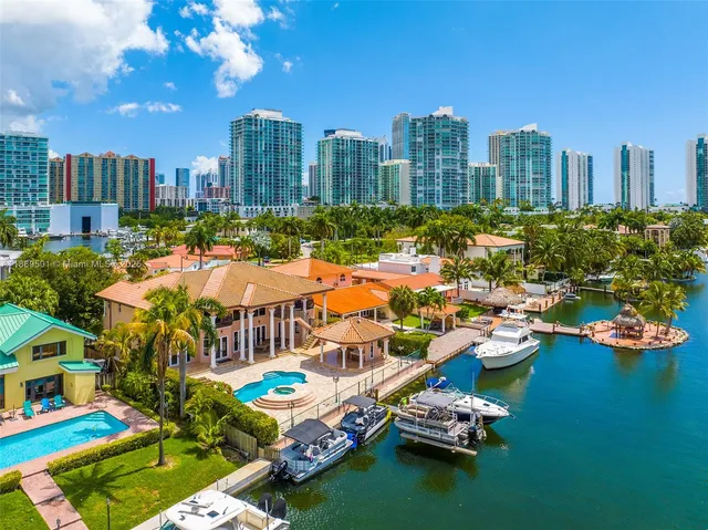 an aerial view of a house with a lake view