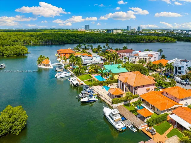 a view of a hallway with entryway and chandelier