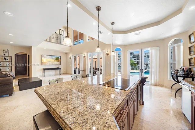 an aerial view of a house with swimming pool patio and outdoor seating