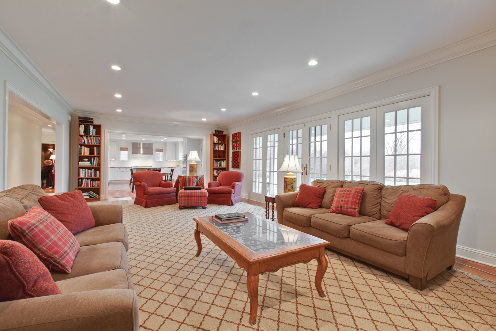 455 Landreth Lane Northfield, IL 60093 - Photo 11 of 31 a living room with furniture ceiling fan and a rug