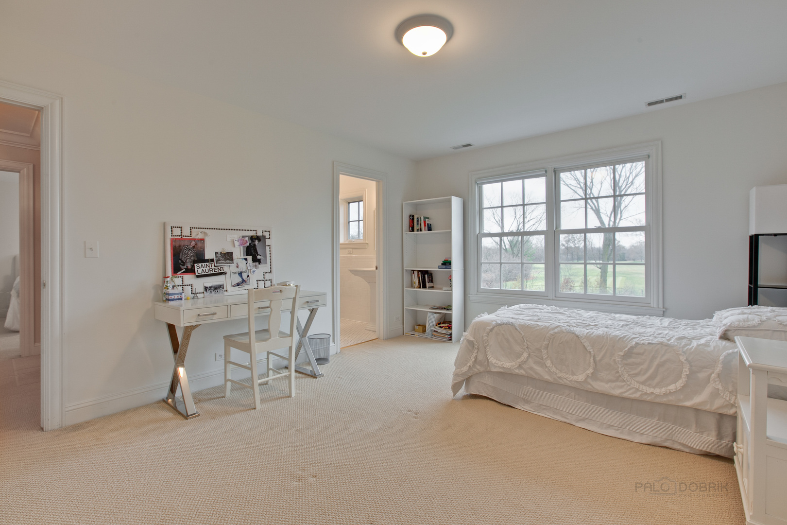 455 Landreth Lane Northfield, IL 60093 - Photo 24 of 31 a bed room with a bed and a chair