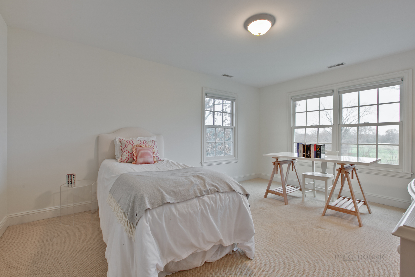 455 Landreth Lane Northfield, IL 60093 - Photo 25 of 31 a bedroom with a bed and a table with chair