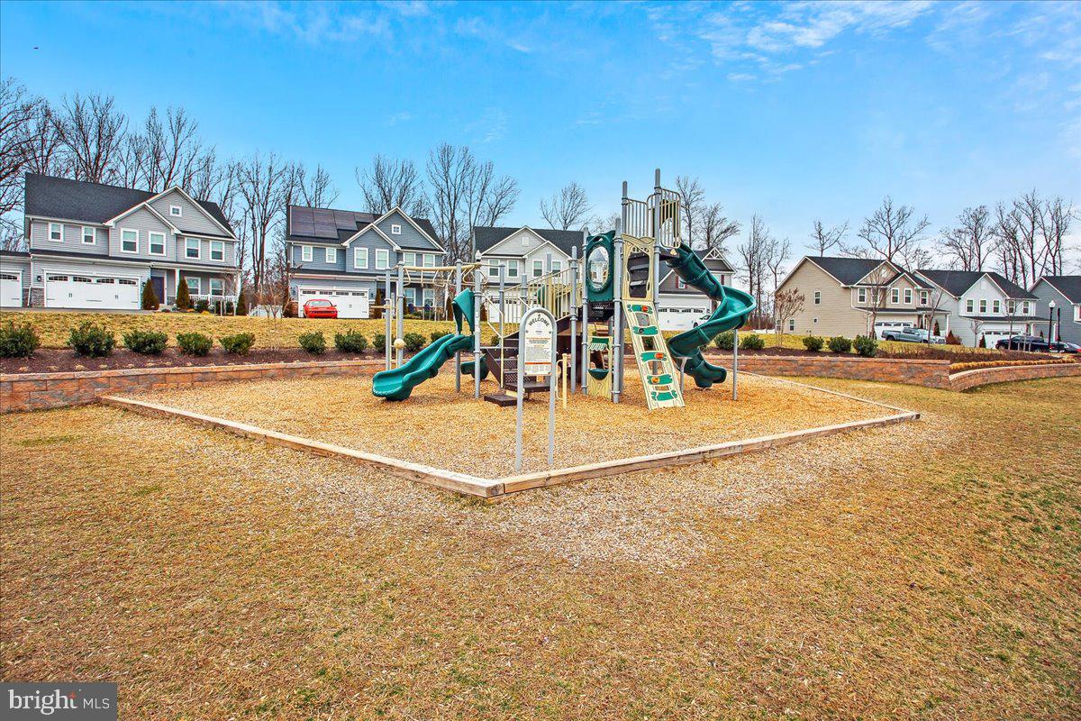 2638 Dragon Fly Way Odenton, MD 21113 - Photo 42 of 45 a view of a swimming pool with an outdoor space and seating area