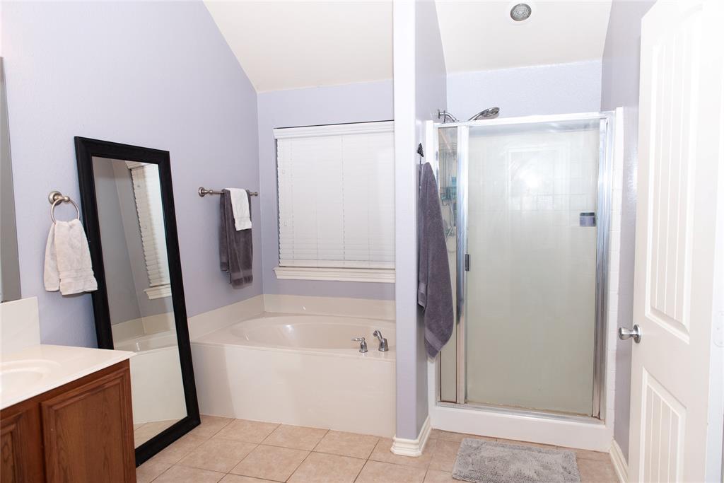 5125 Shelly Ray Road Fort Worth, TX 76244 - Photo 15 of 27 Bathroom with a bath, vanity, light tile patterned floors, and a stall shower