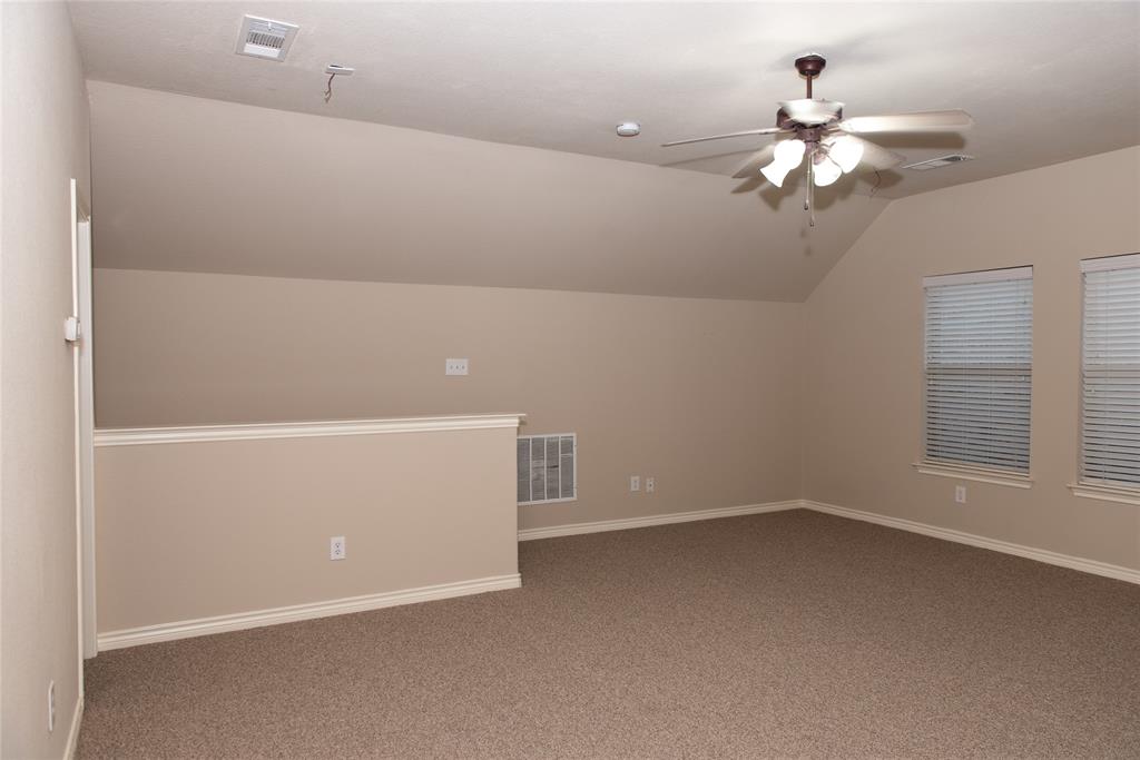 5125 Shelly Ray Road Fort Worth, TX 76244 - Photo 21 of 27 Additional living space featuring vaulted ceiling, carpet, and ceiling fan