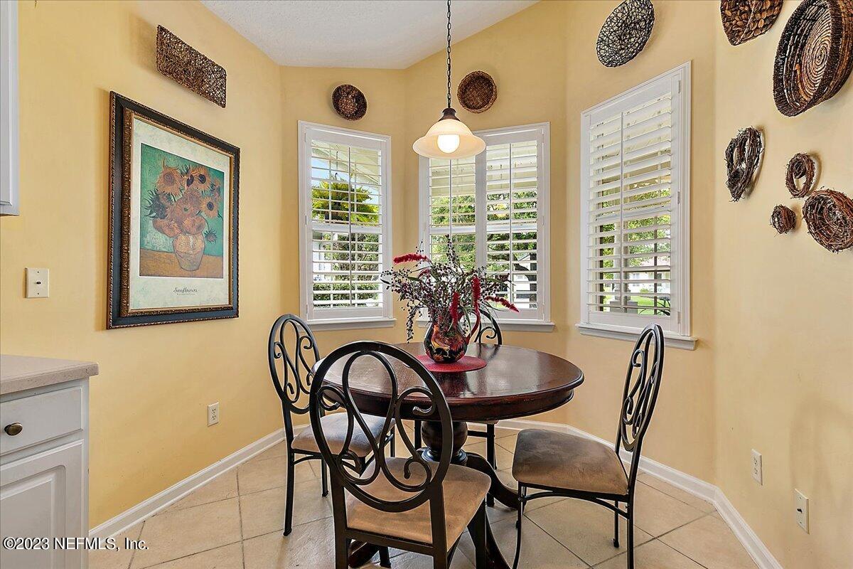 694 Copperhead Circle St. Augustine, FL 32092 - Photo 13 of 27 a view of a dining room with furniture and windows