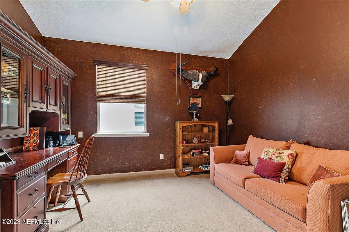 694 Copperhead Circle St. Augustine, FL 32092 - Photo 14 of 27 a reading room with furniture and a window