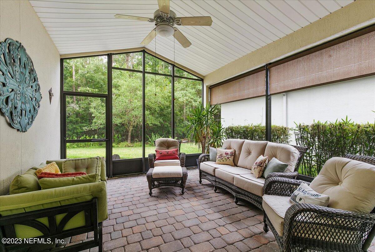 694 Copperhead Circle St. Augustine, FL 32092 - Photo 21 of 27 a living room with furniture and a large window