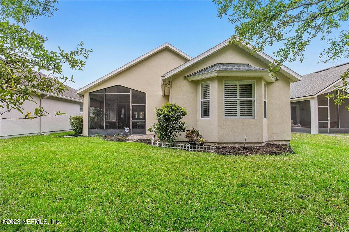 694 Copperhead Circle St. Augustine, FL 32092 - Photo 25 of 27 a front view of house with yard