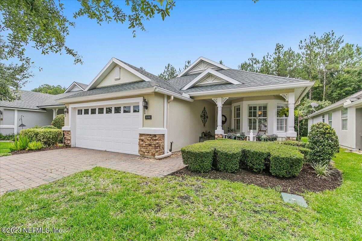 694 Copperhead Circle St. Augustine, FL 32092 - Photo 3 of 27 a front view of a house with garden