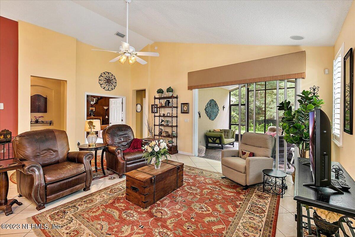 694 Copperhead Circle St. Augustine, FL 32092 - Photo 7 of 27 a living room with furniture fireplace and a flat screen tv