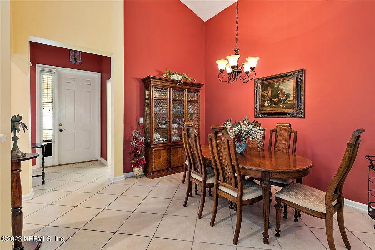 694 Copperhead Circle St. Augustine, FL 32092 - Photo 10 of 27 a view of a dining room with furniture and chandelier