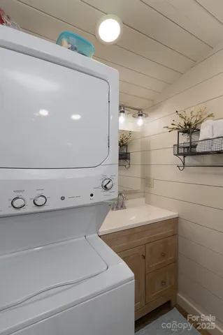 a bathroom with a double vanity sink a mirror and shower