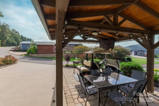 a view of a patio with a table and chairs