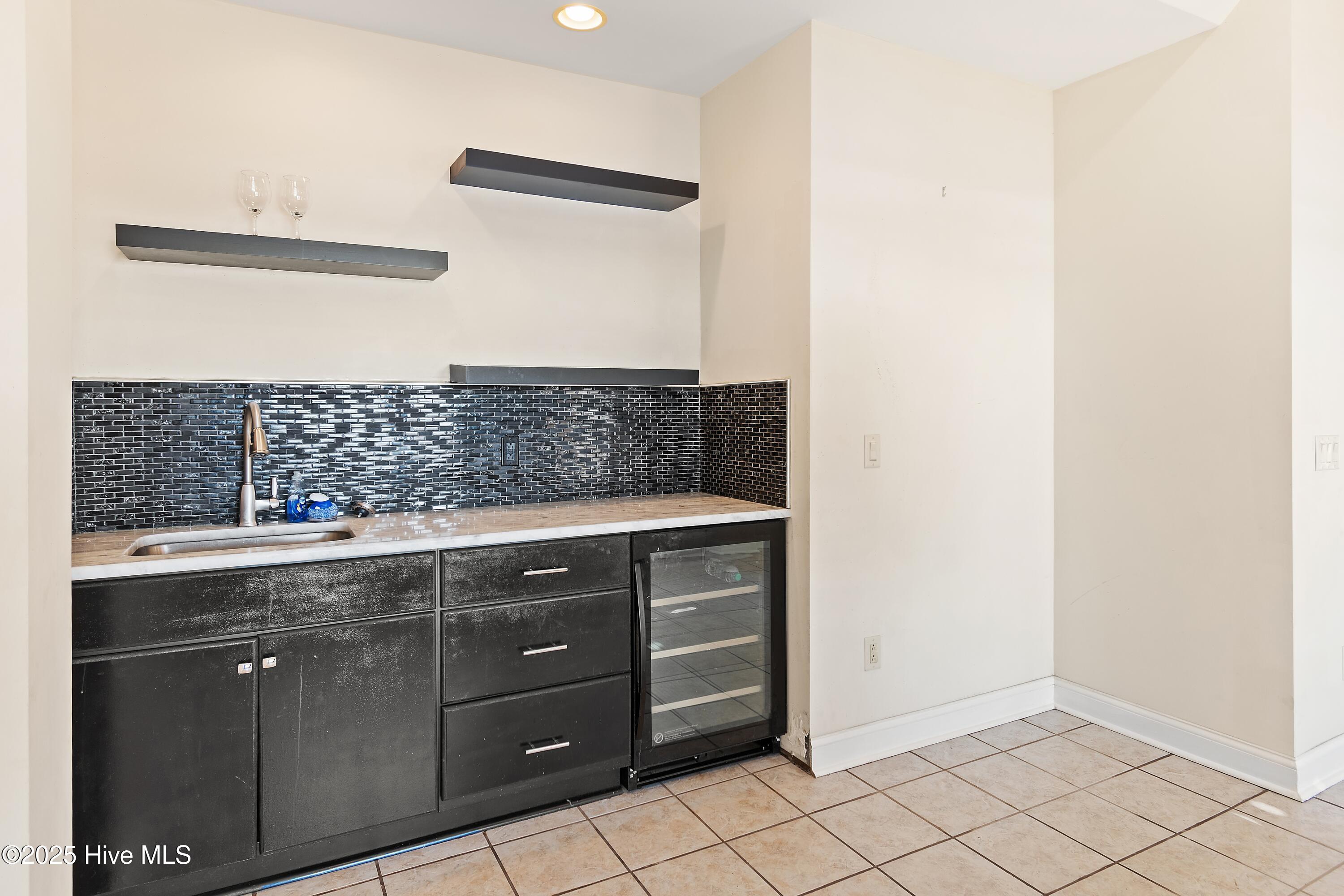 6777 Roberta Road Southwest Ocean Isle Beach, NC 28469 - Photo 63 of 89 See the area on the Left side where a larger Refrigerator could be added. Also opens to huge porch and view of the ICW