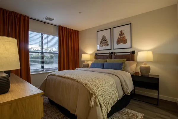a bedroom with bed and window