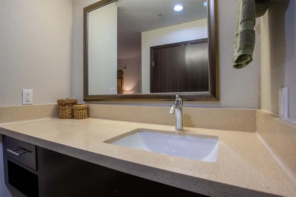 a bathroom with a sink and a mirror