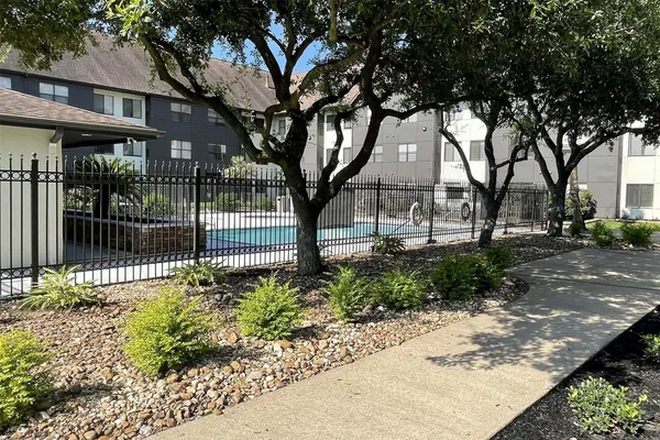 a view of a pathway with a yard