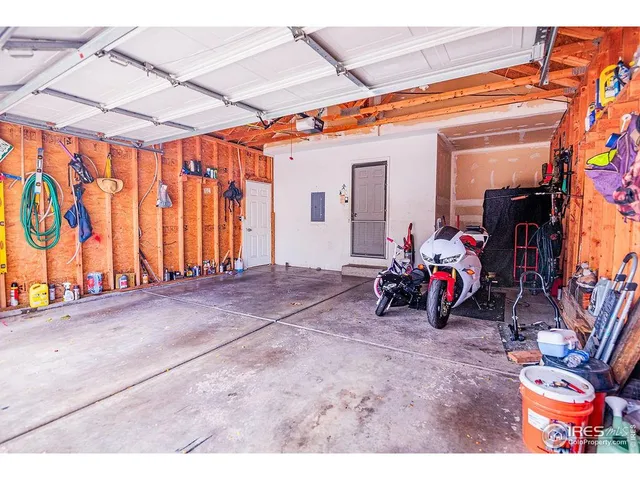 a view of a garage with furniture and a bike