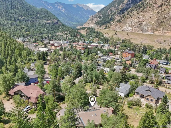 an aerial view of house with yard