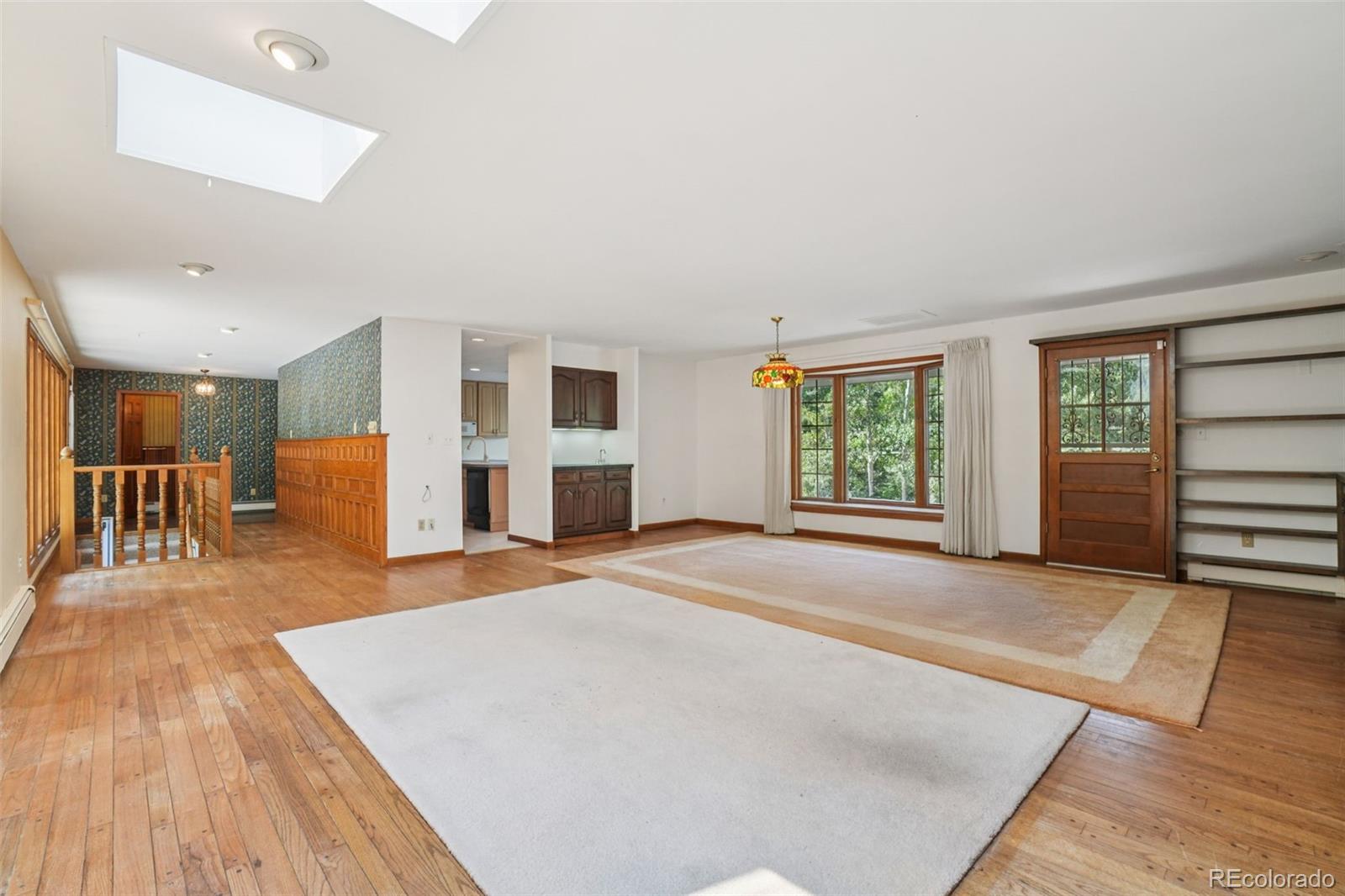 203 Ninth Street Georgetown, CO 80444 - Photo 24 of 44 a view of livingroom with furniture wooden floor and windows