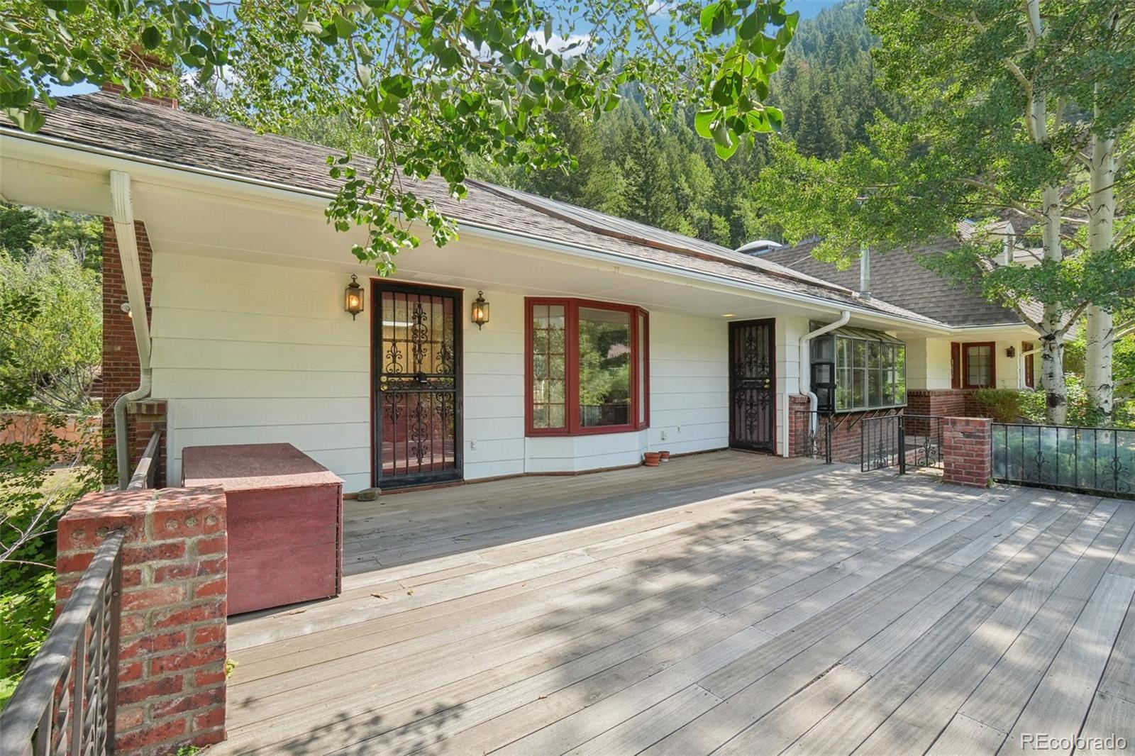 203 Ninth Street Georgetown, CO 80444 - Photo 3 of 44 a front view of a house with garden