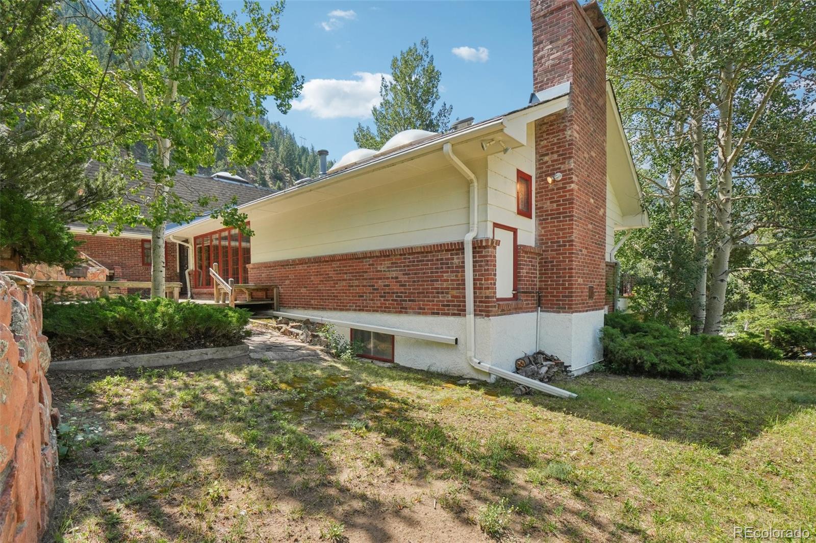 203 Ninth Street Georgetown, CO 80444 - Photo 7 of 44 a view of a house with a yard