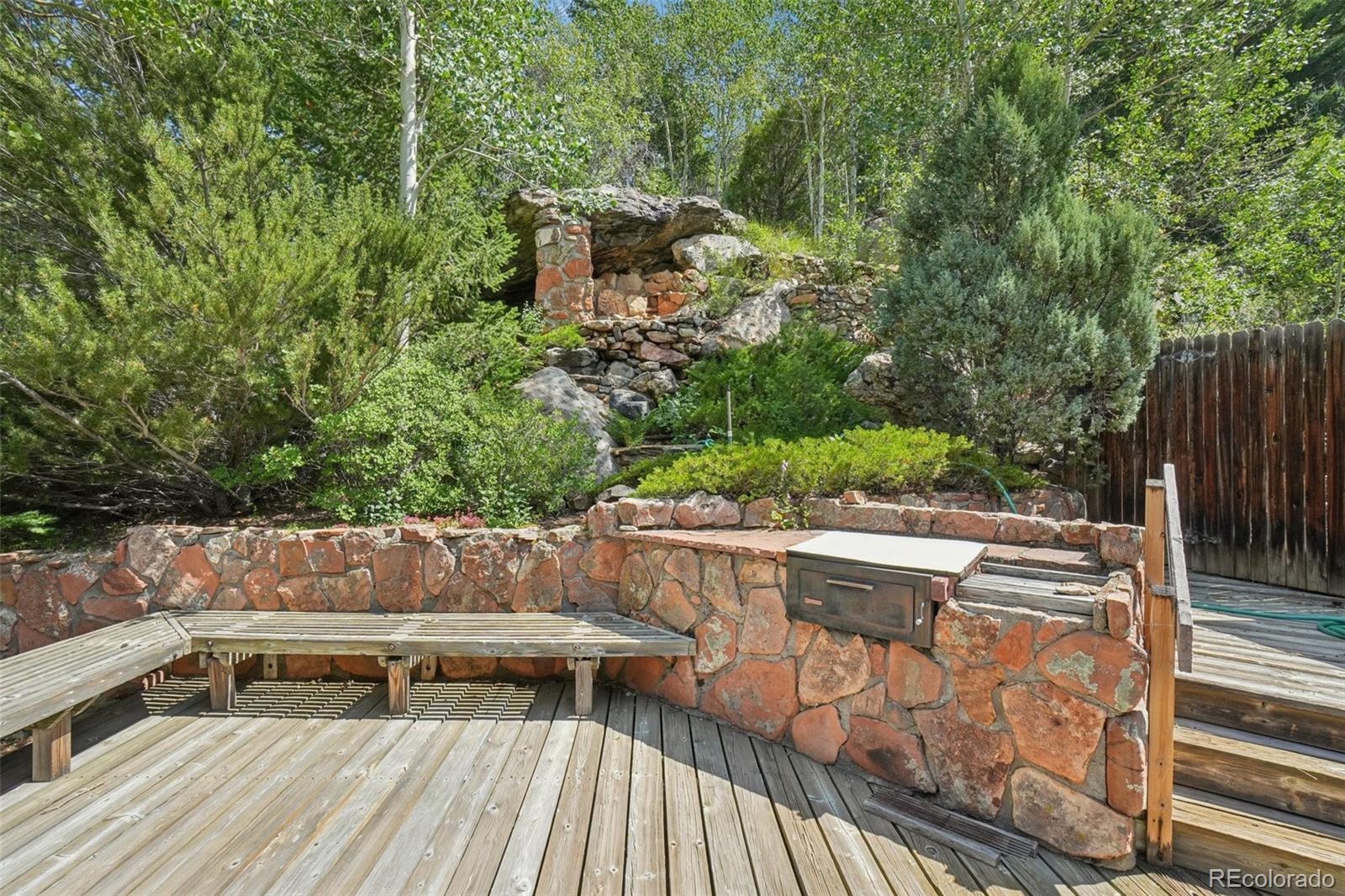 203 Ninth Street Georgetown, CO 80444 - Photo 9 of 44 a view of balcony with wooden floor and outdoor seating
