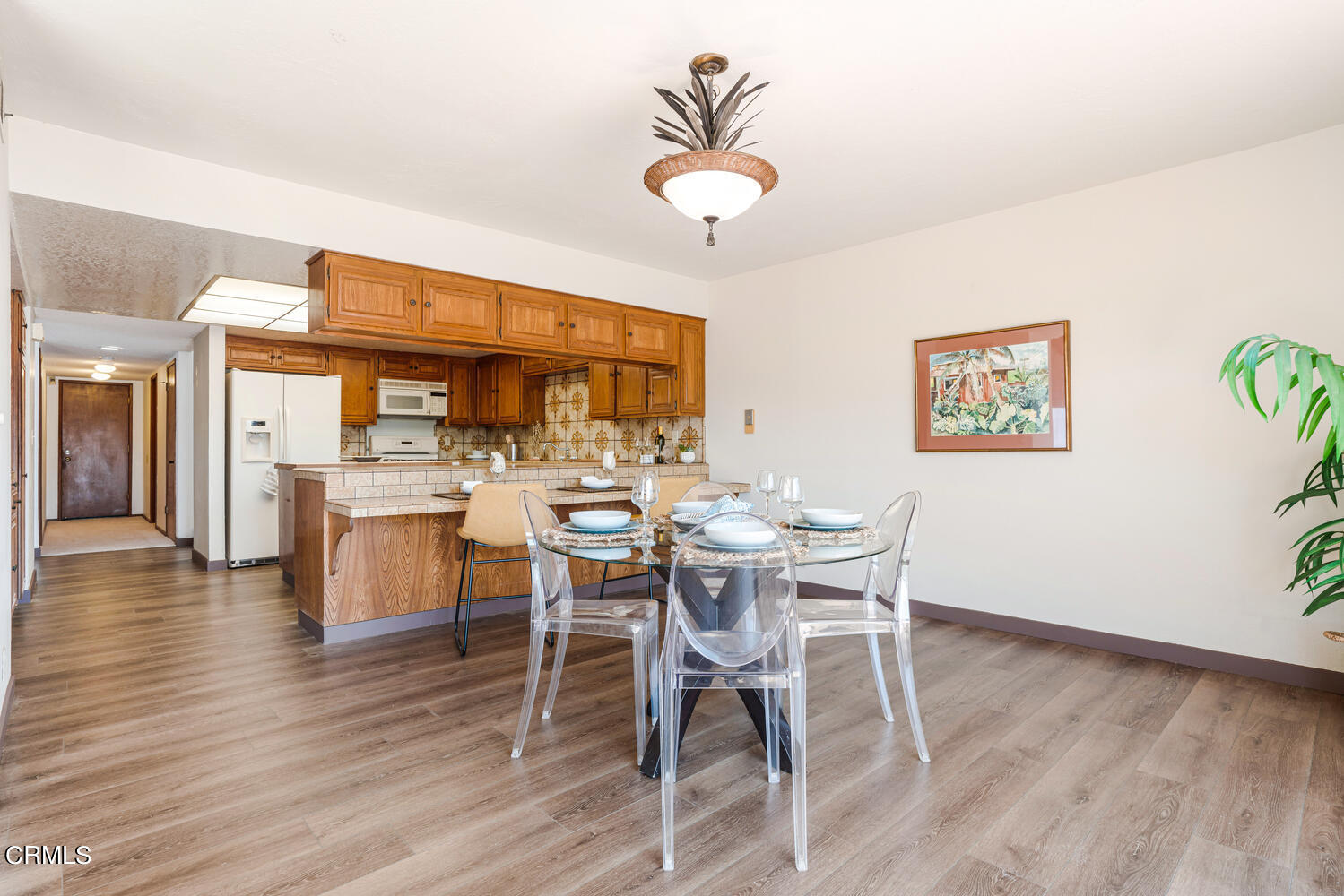 2101 Napoli Drive Oxnard, CA 93035 - Photo 13 of 50 a view of a dining room with furniture and wooden floor