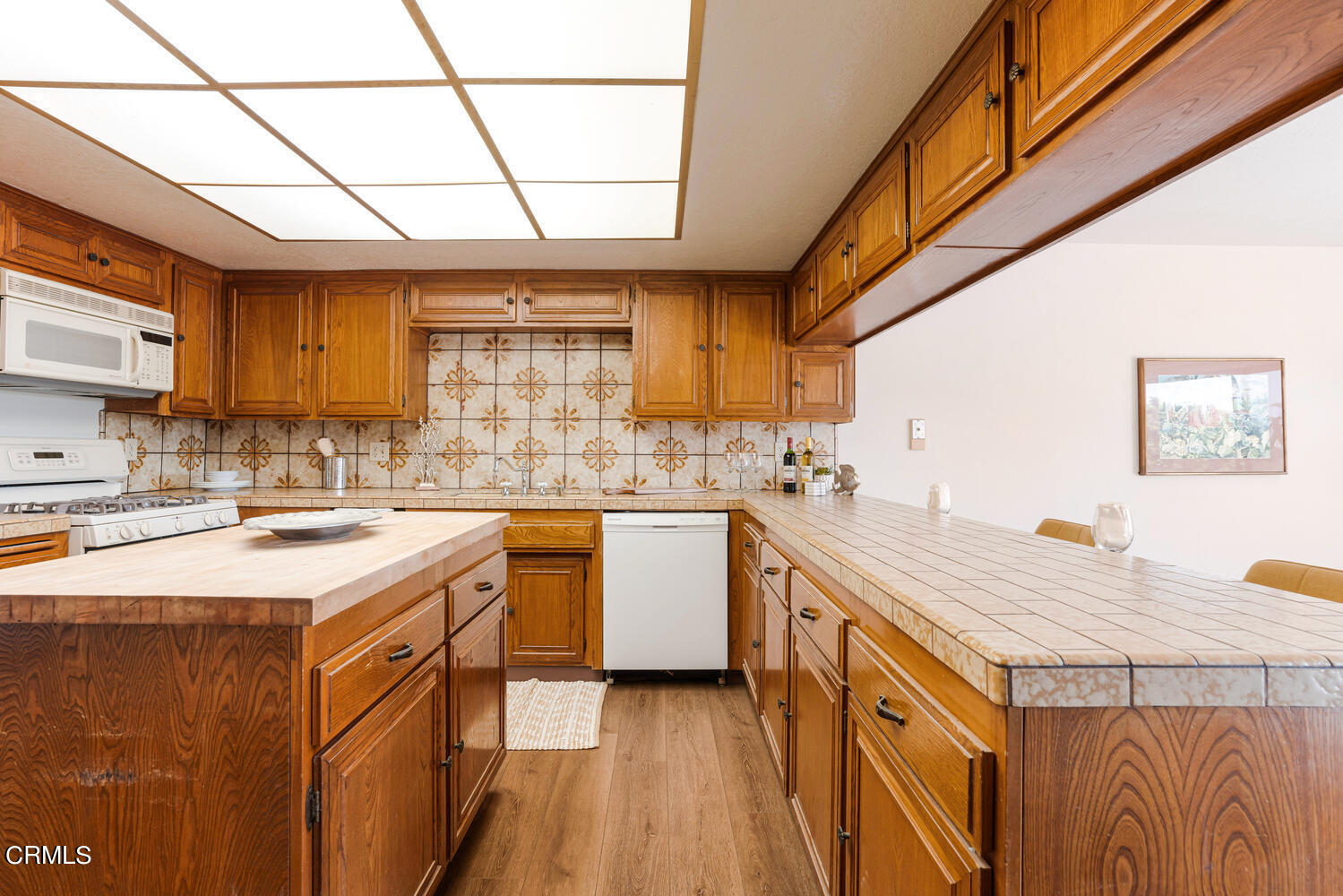 2101 Napoli Drive Oxnard, CA 93035 - Photo 18 of 50 a kitchen with a sink cabinets appliances and a window