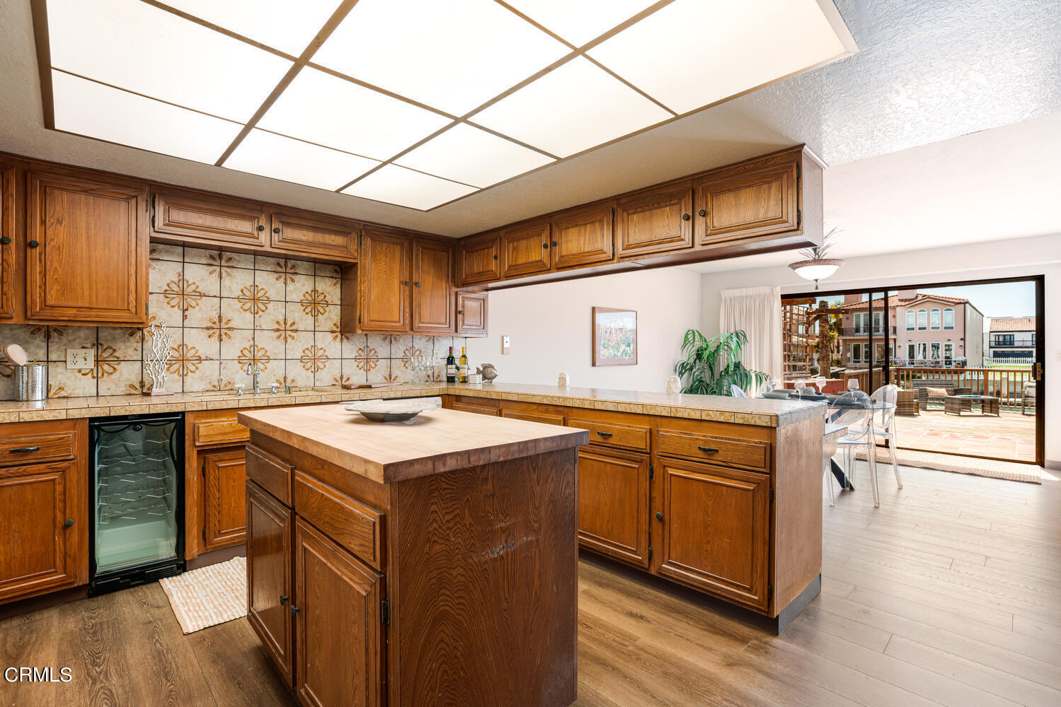 2101 Napoli Drive Oxnard, CA 93035 - Photo 19 of 50 a kitchen with stainless steel appliances granite countertop a lot of counter space and wooden floors
