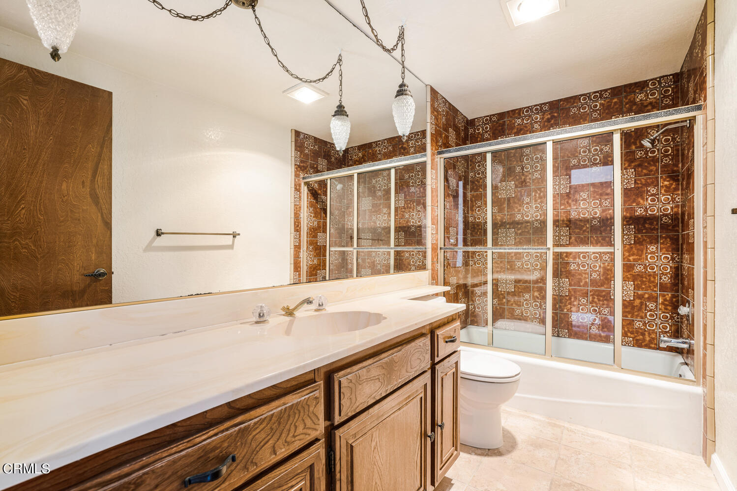2101 Napoli Drive Oxnard, CA 93035 - Photo 28 of 50 a bathroom with a sink a toilet a mirror and shower