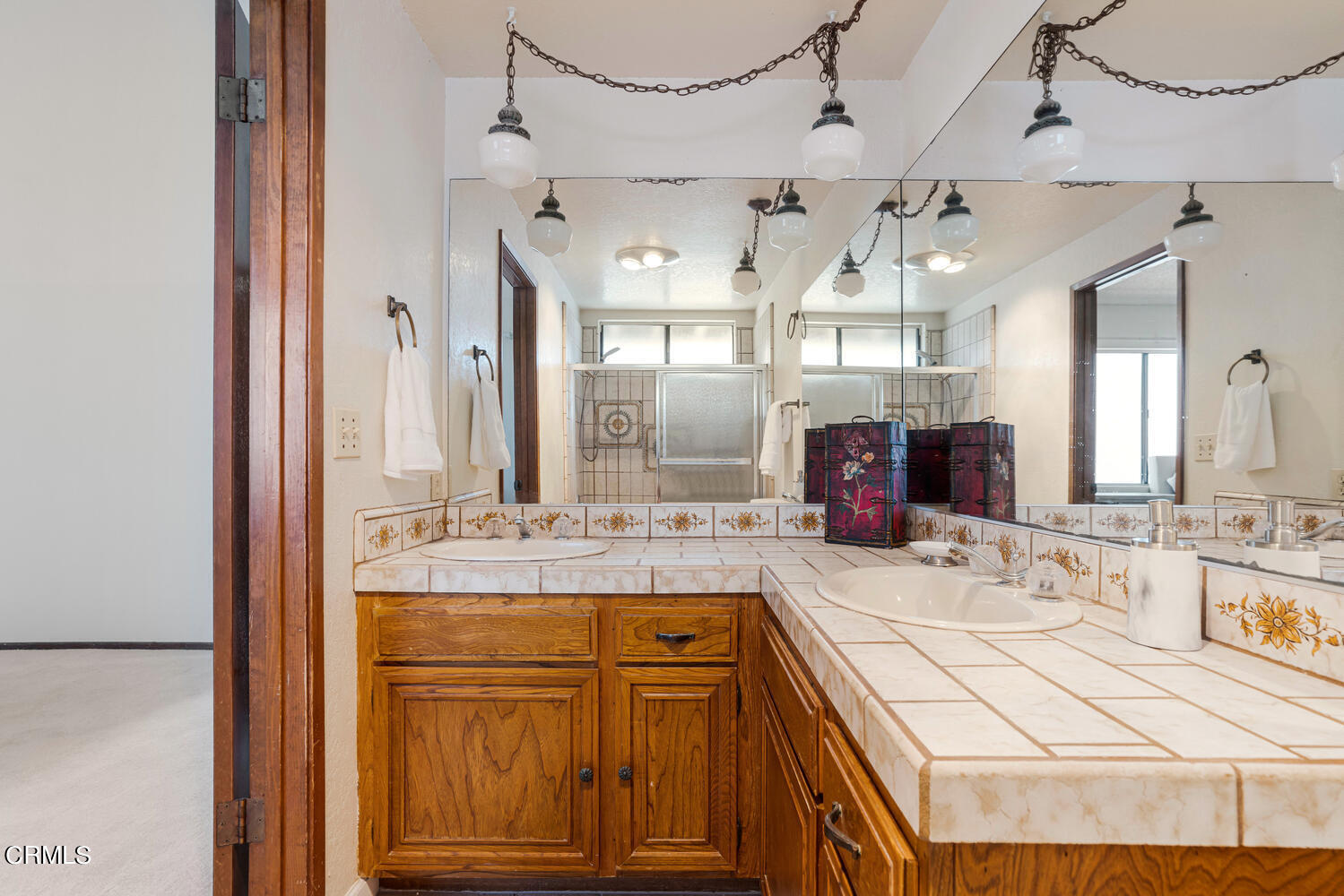 2101 Napoli Drive Oxnard, CA 93035 - Photo 31 of 50 a bathroom with a granite countertop double vanity sink and a mirror