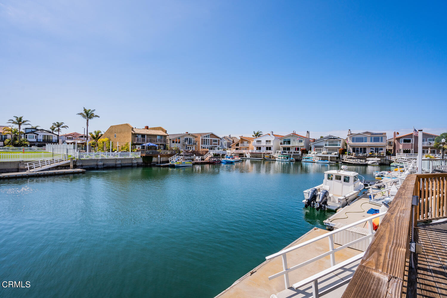2101 Napoli Drive Oxnard, CA 93035 - Photo 44 of 50 a view of a lake with boats and trees in the background