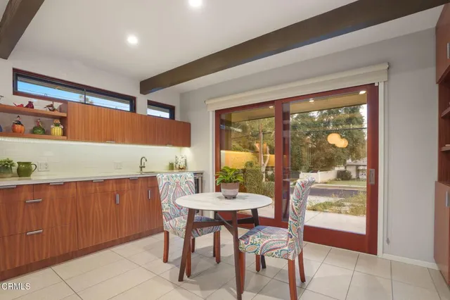 a dining room with a large window and table