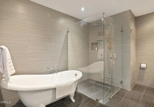 a white toilet sitting next to a bathroom sink