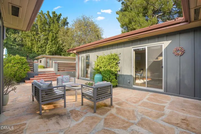 a house view with a outdoor seating space