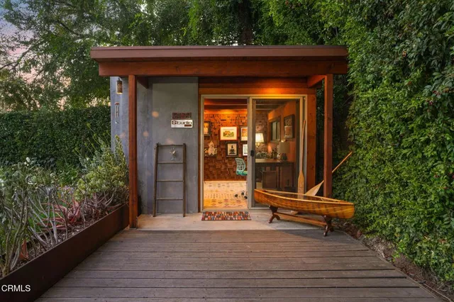 a view of two chairs in the balcony