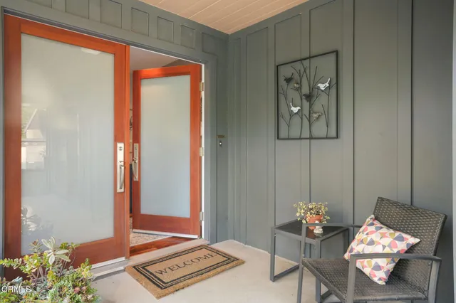 a living room with furniture and window