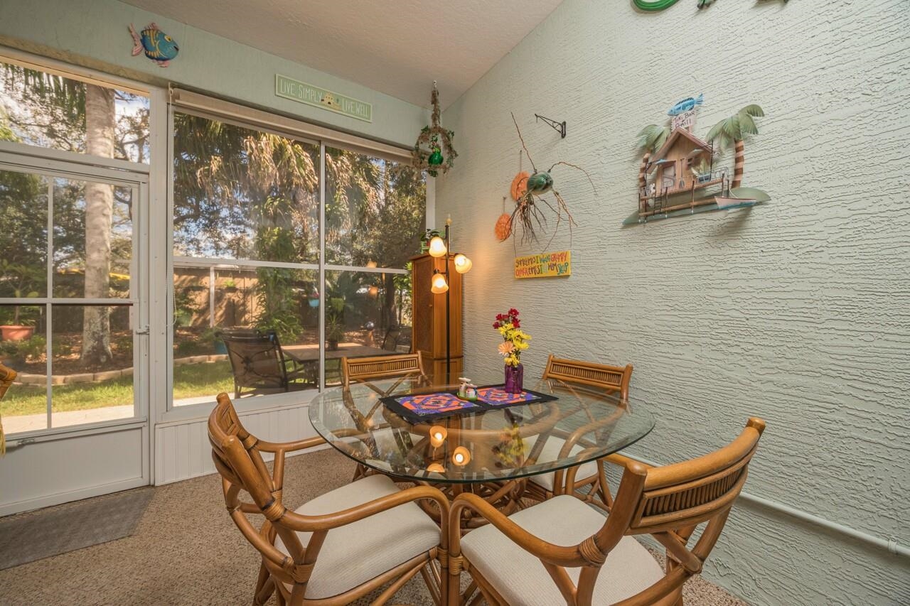 1041 Ridgewood Lane St. Augustine, FL 32086 - Photo 11 of 40 a view of a dining room with furniture and wooden floor