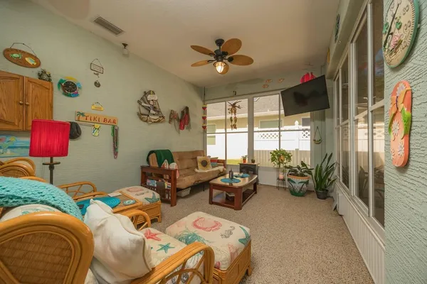 a bedroom with furniture and a window
