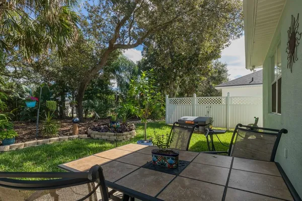 a view of a backyard with sitting area