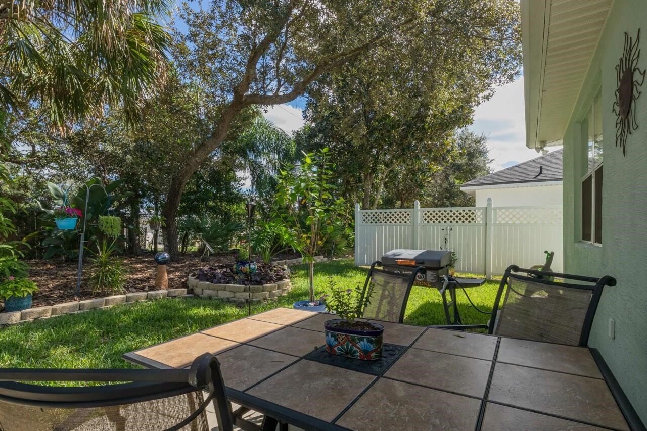 1041 Ridgewood Lane St. Augustine, FL 32086 - Photo 21 of 40 a view of a backyard with sitting area