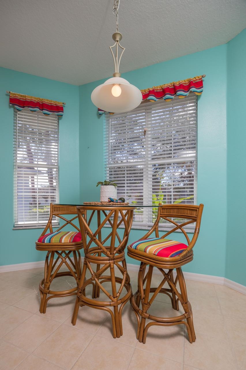 1041 Ridgewood Lane St. Augustine, FL 32086 - Photo 26 of 40 a backyard of a house with table and chairs