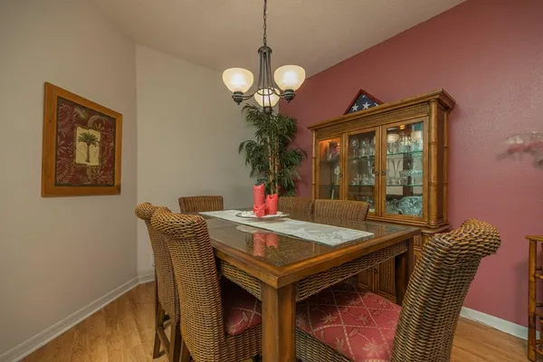 a view of a dining room with furniture and wooden floor